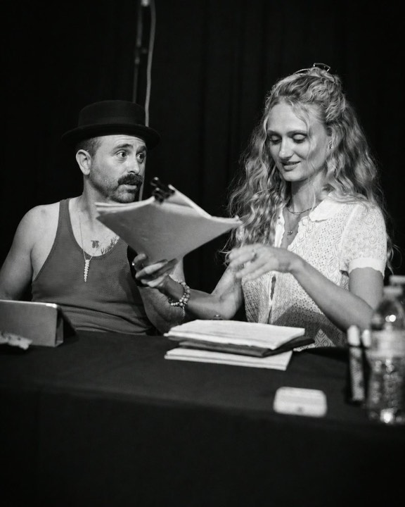 Actors sharing a playful moment during the table read